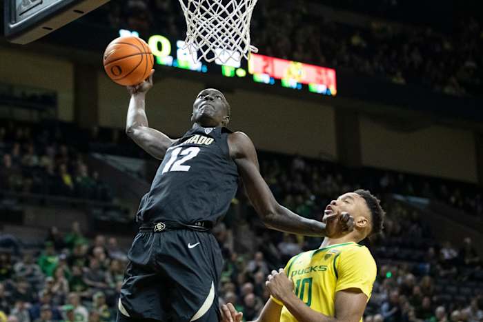 Colorado forward Bangot Dak dunks the ball as the Oregon Ducks host the Colorado Buffaloes Thursday, March 7, 2024 at Matthew Knight Arena in Eugene, Ore